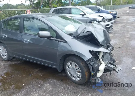 2011 Honda Insight z USA, uszkodzony, nr VIN JHMZE2H33BS003340
